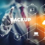 business man selecting word "backup" from modern virtual interface
