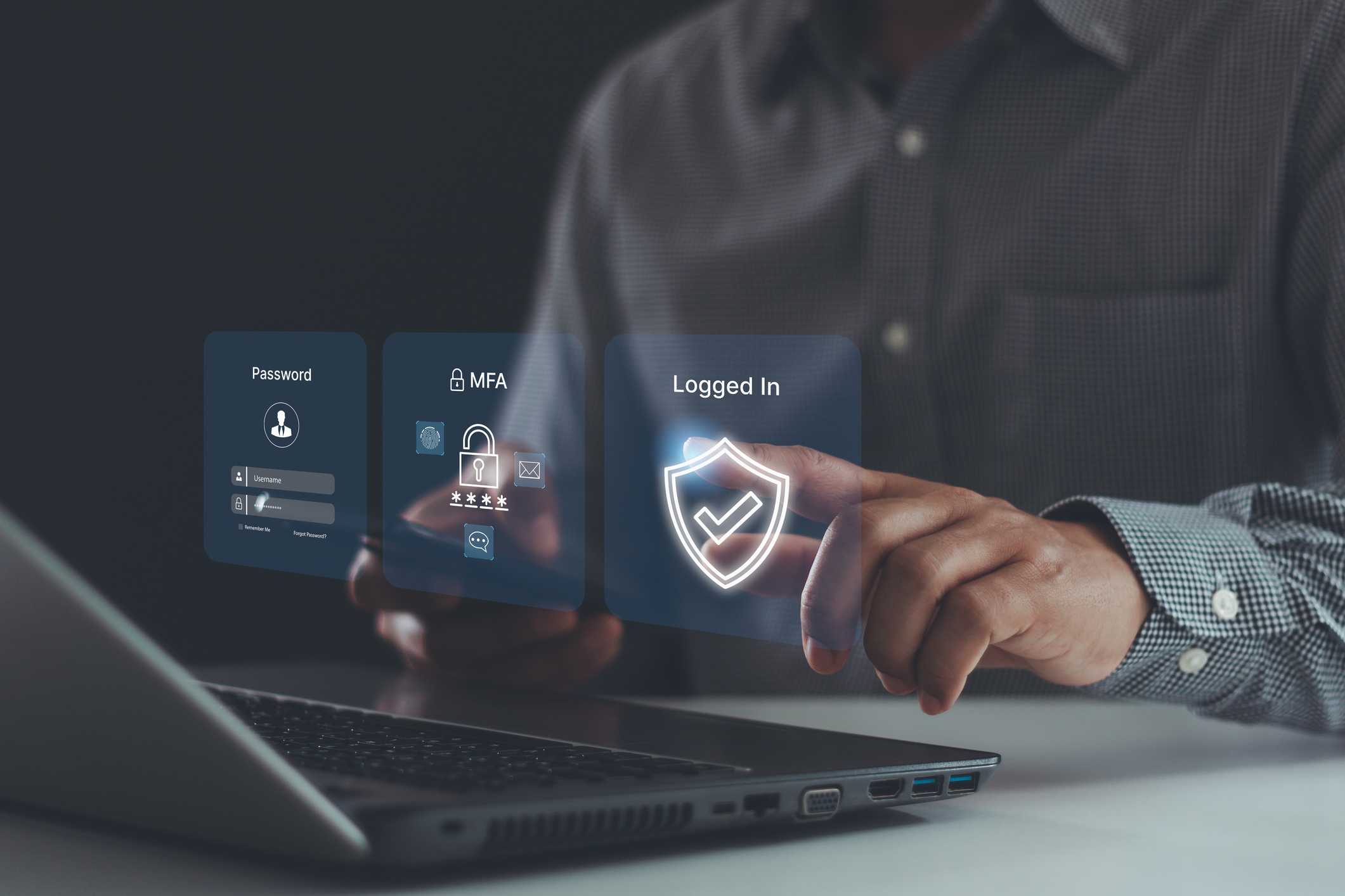 Patch management for ransomware defense. This image shows someone interacting with a holographic interface emerging from a laptop. They touch virtual screens displaying icons indicating password entry, multi-factor authentication (MFA), and a shield icon confirming successful login. The person is in professional attire, reinforcing the concept of secure digital identity verification and cybersecurity.