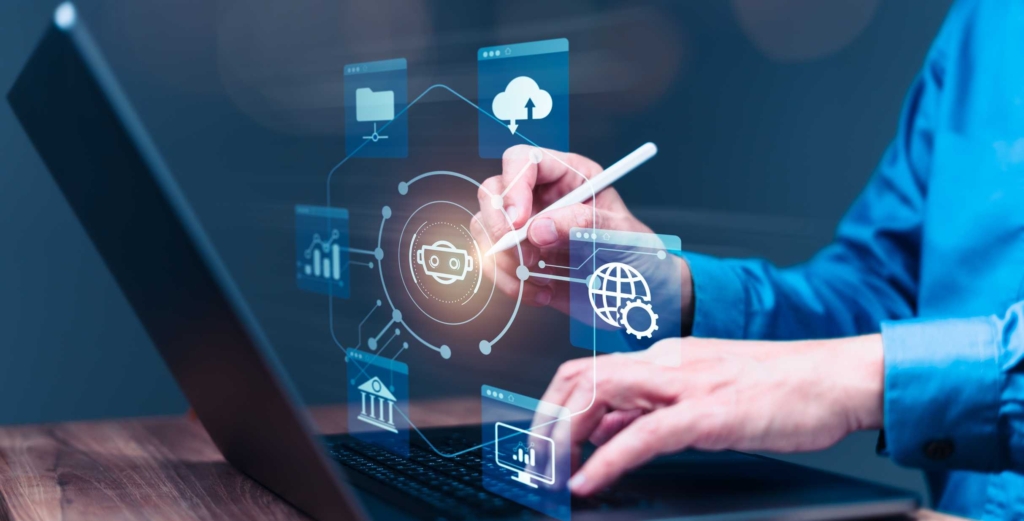 Ransomware risk management framework. A professional wearing a blue shirt is interacting with a virtual, transparent interface emerging from their laptop. They use a stylus pen, suggesting precise control. Floating around their hands are various icons symbolizing technology, including cloud services, data analytics, global connectivity, finance or banking, and artificial intelligence. The image conveys the themes of digital transformation, data analysis, and secure management through technology.