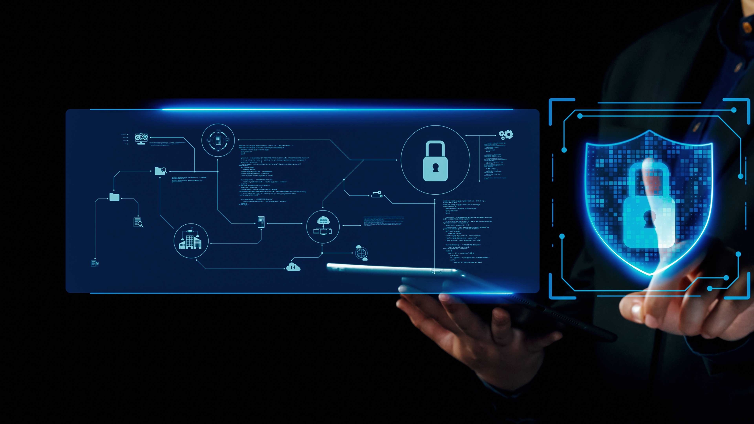 Supply chain ransomware security. A dark background highlights a person interacting with an advanced digital security interface. On the left side, a glowing, detailed diagram with interconnected elements and security icons represents complex cybersecurity planning. To the right is a glowing digital shield containing a padlock symbol, representing strong protection and defense against cyber threats.