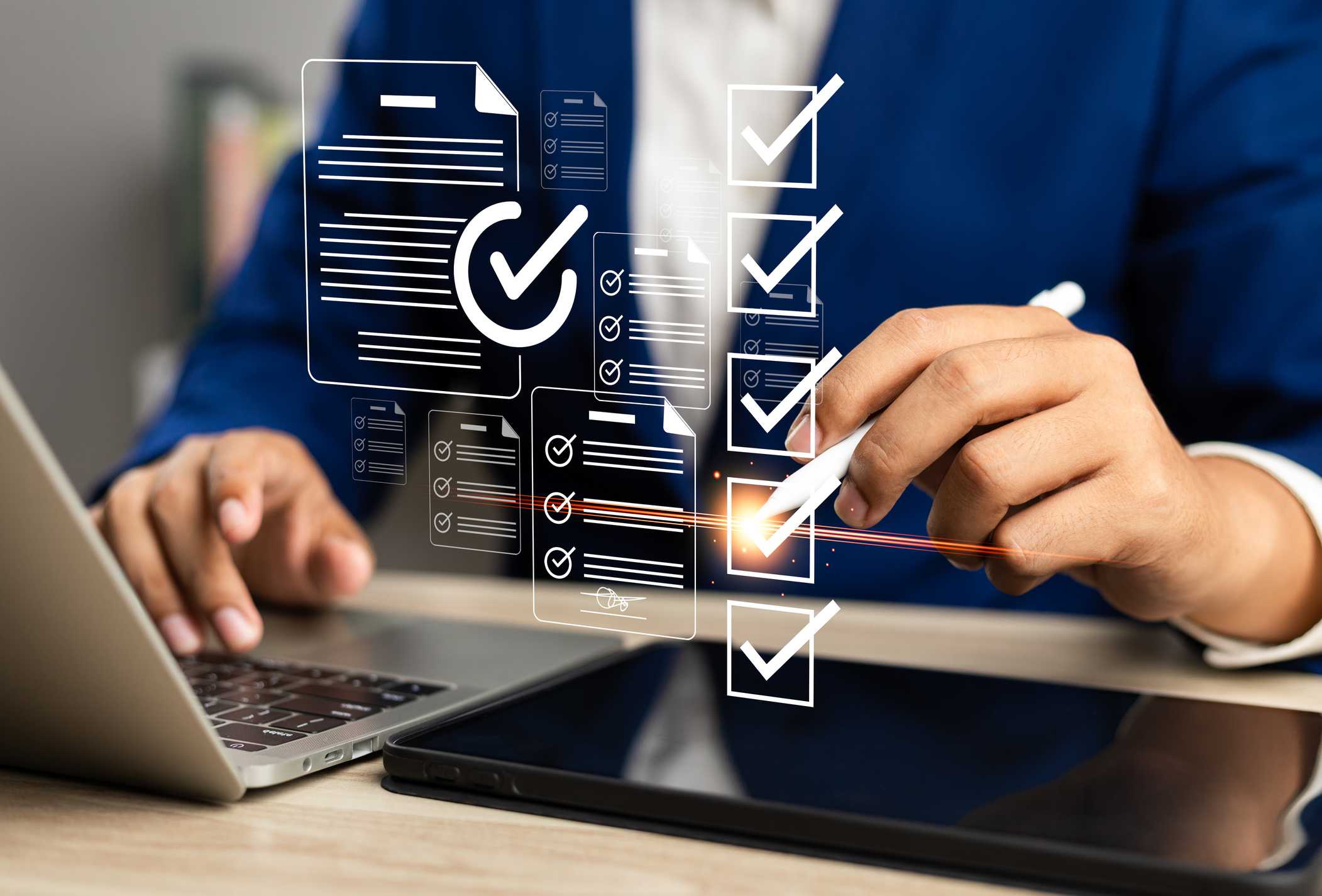 Employee Cyber Hygiene Training. A person in business attire uses a stylus to check off floating digital checkboxes and form icons over a laptop and tablet. It illustrates modern digital workflow, approval systems, or incident reporting.