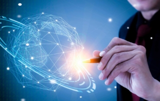 Infrastructure Security Monitoring. A hand holds a stylus and appears to draw or interact with a 3D holographic globe composed of geometric patterns and data points, symbolizing innovation, global networks, or cybersecurity visualization.