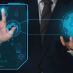 DevSecOps ransomware integration. A person in a business suit holding a glowing holographic globe connected to a transparent futuristic display panel with various icons and data visuals.