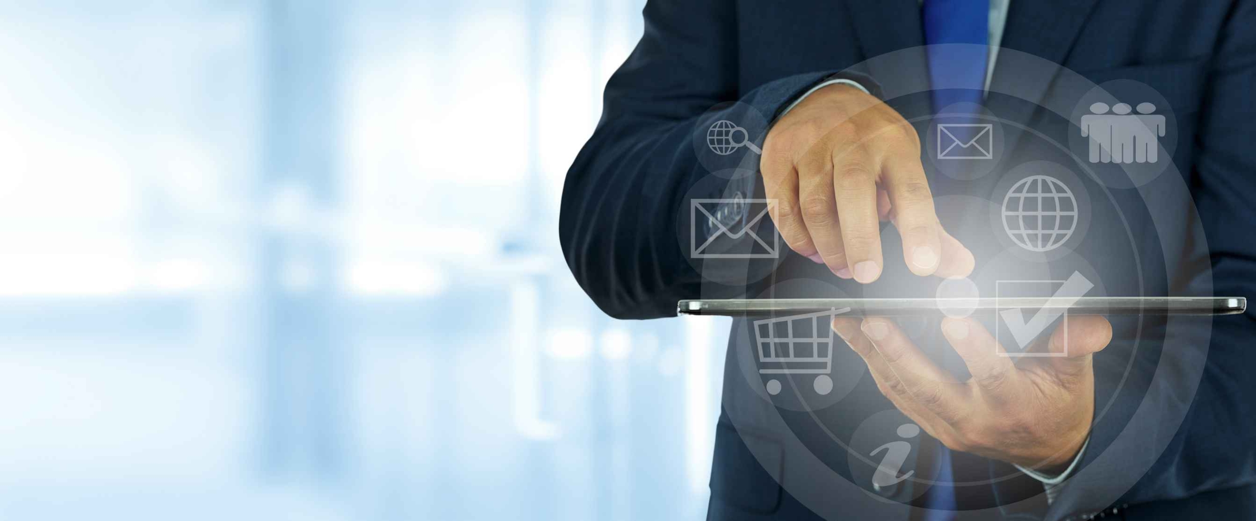 Zero Trust Network Implementation. A business professional in a suit uses a tablet device. Overlay icons are arranged in a circular interface around the device, featuring symbols for email, shopping cart, user profiles, globe, and documents. The person is tapping the screen, emphasizing business operations, mobile productivity, or cloud computing.
