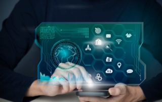 Compliance-Ready Cyber Frameworks. Two hands holding a phone that displays a glowing digital dashboard filled with icons, including location pins, network signals, and app notifications. A globe and a matrix-style hexagonal interface dominate the screen, suggesting global cybersecurity or IoT management.